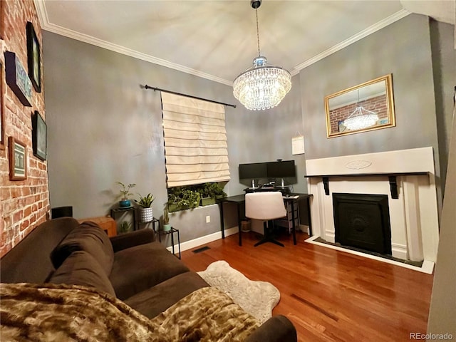 office area with baseboards, visible vents, ornamental molding, wood finished floors, and a fireplace