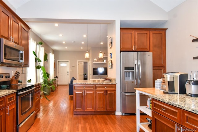 kitchen featuring lofted ceiling, light stone countertops, light wood-type flooring, and stainless steel appliances