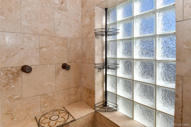 full bath with a tile shower