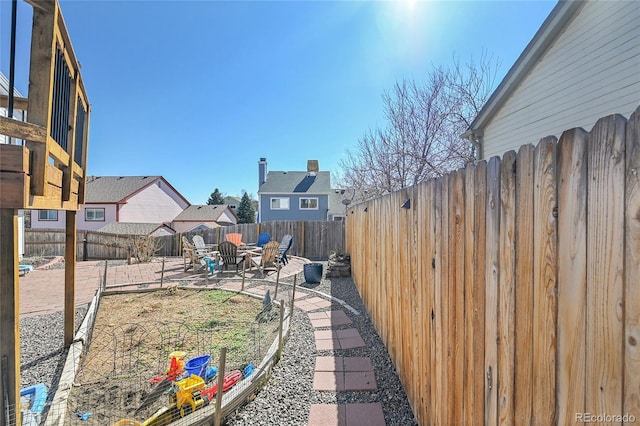 view of yard with a patio area and a fenced backyard