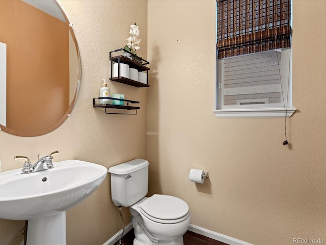 11945 S Saunter Ln, Parker, CO 80138 - half bathroom featuring toilet and a sink