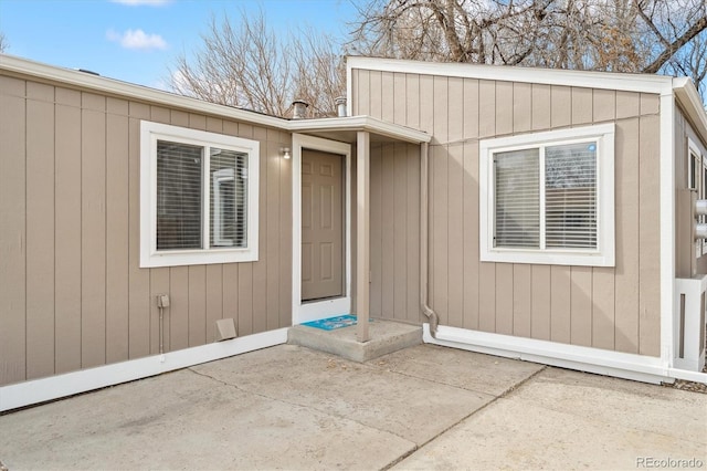 doorway to property with a patio