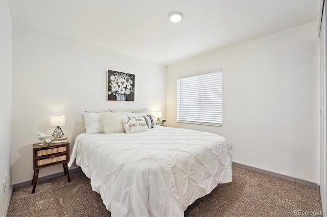 carpeted bedroom with baseboards