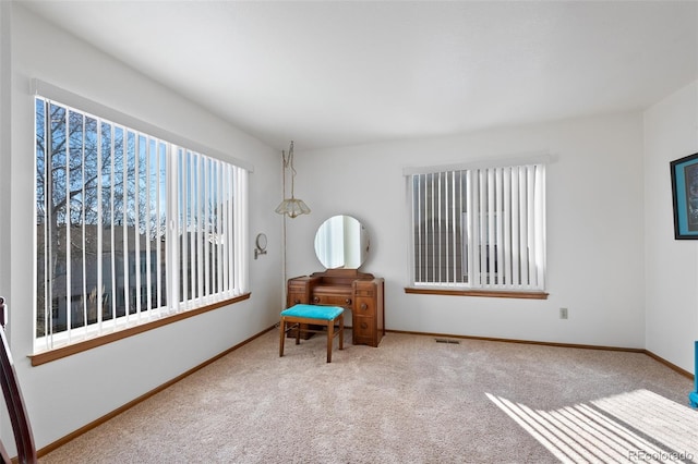 8441 Urban Ct, Arvada, CO 80005 - living area featuring visible vents, baseboards, and carpet flooring