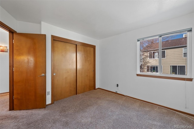 8441 Urban Ct, Arvada, CO 80005 - unfurnished bedroom with a closet, carpet flooring, and baseboards