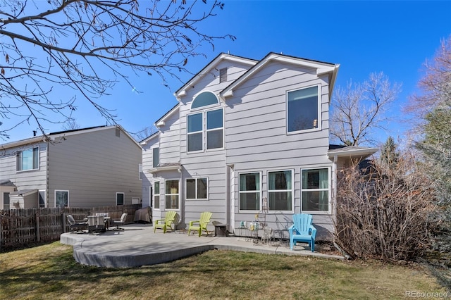 8441 Urban Ct, Arvada, CO 80005 - back of property featuring a lawn, a patio, and fence