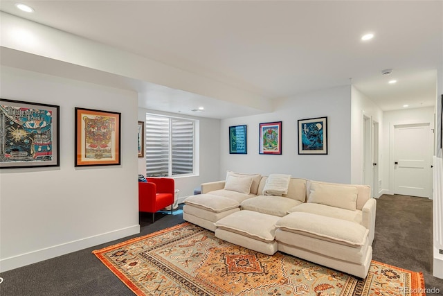 carpeted living area with recessed lighting and baseboards