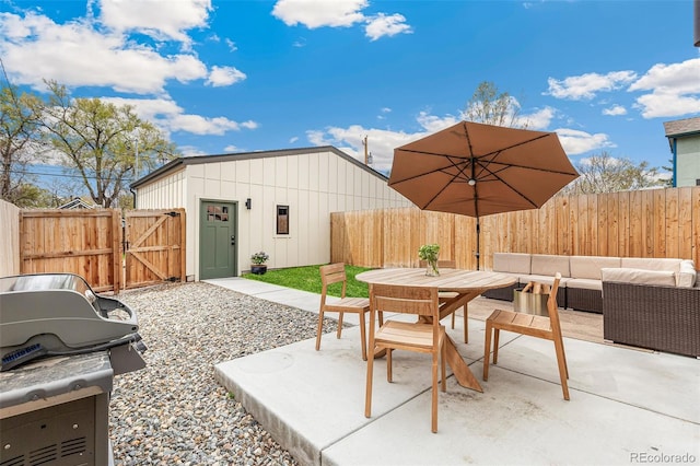 view of patio / terrace featuring grilling area, a fenced backyard, a gate, and outdoor dining area