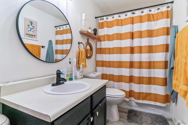 bathroom featuring hardwood / wood-style floors, vanity, and toilet