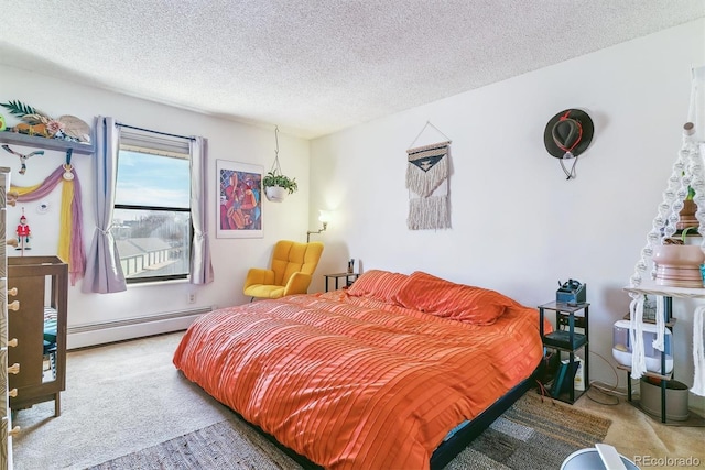 carpeted bedroom with a baseboard heating unit and a textured ceiling