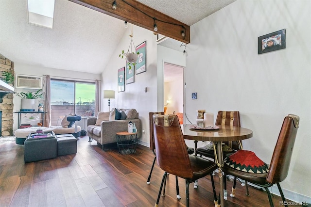 dining room featuring beam ceiling, dark wood-type flooring, a textured ceiling, high vaulted ceiling, and a wall unit AC