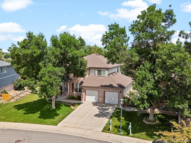 3043 W 109th Pl, Westminster, CO 80031 - view of front of property with driveway, brick siding, a front lawn, roof with shingles, and an attached garage