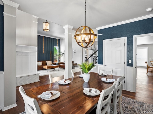 3043 W 109th Pl, Westminster, CO 80031 - dining space with a chandelier, wood finished floors, stairway, decorative columns, and crown molding
