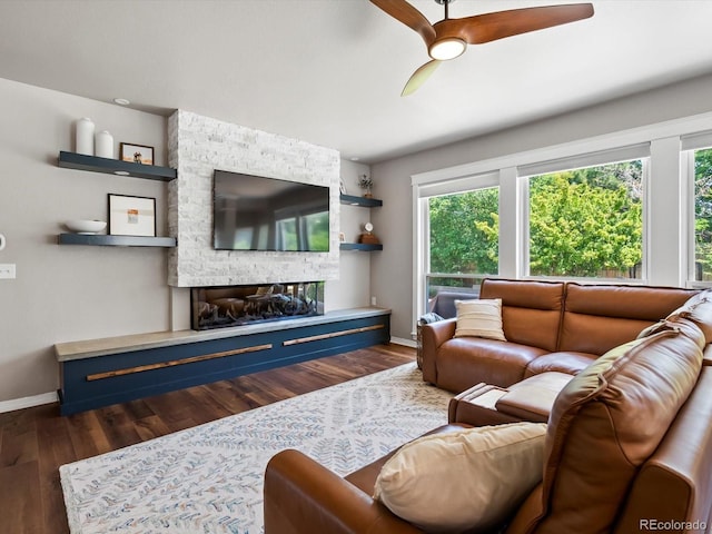 3043 W 109th Pl, Westminster, CO 80031 - living area with dark wood finished floors, a ceiling fan, and a fireplace