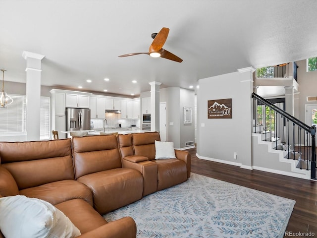3043 W 109th Pl, Westminster, CO 80031 - living room with ornate columns, a ceiling fan, dark wood-style flooring, recessed lighting, and stairway