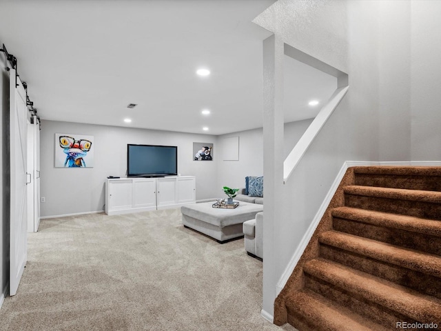 3043 W 109th Pl, Westminster, CO 80031 - carpeted living room featuring a barn door, stairs, and recessed lighting
