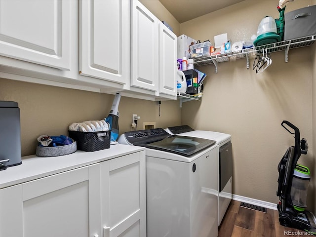 3043 W 109th Pl, Westminster, CO 80031 - laundry room featuring washer and dryer, dark wood-style floors, and cabinet space