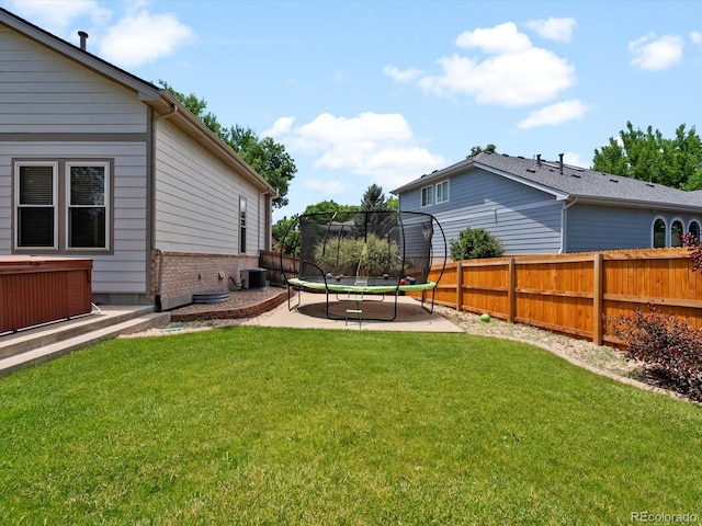 3043 W 109th Pl, Westminster, CO 80031 - fenced backyard featuring a trampoline and a patio