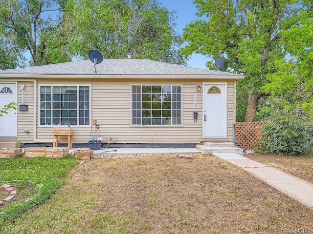 3304 W 3rd Ave, Denver, CO 80219 - view of front of home featuring entry steps and a front lawn