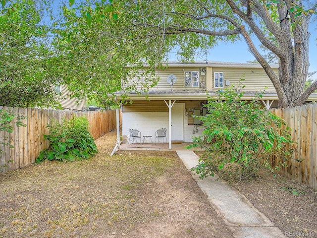 3304 W 3rd Ave, Denver, CO 80219 - rear view of property with a patio area and a fenced backyard
