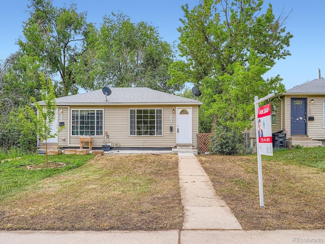 3304 W 3rd Ave, Denver, CO 80219 - view of front facade featuring entry steps and a front lawn