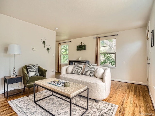 3304 W 3rd Ave, Denver, CO 80219 - living room featuring plenty of natural light and wood finished floors