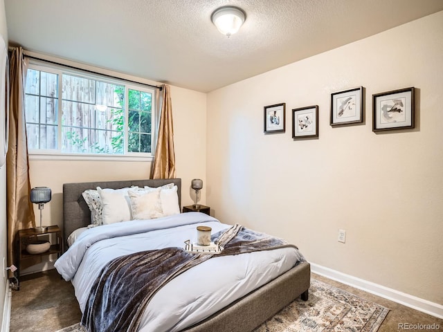 3304 W 3rd Ave, Denver, CO 80219 - bedroom with a textured ceiling and baseboards