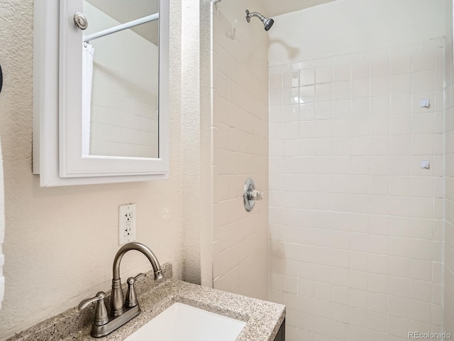 3304 W 3rd Ave, Denver, CO 80219 - bathroom with a tile shower and vanity