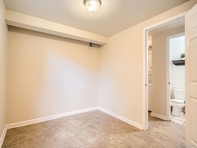 3304 W 3rd Ave, Denver, CO 80219 - empty room with a textured ceiling and baseboards