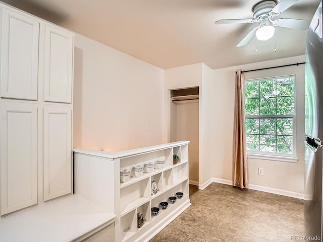 3304 W 3rd Ave, Denver, CO 80219 - bedroom with freestanding refrigerator, light colored carpet, a closet, and a ceiling fan