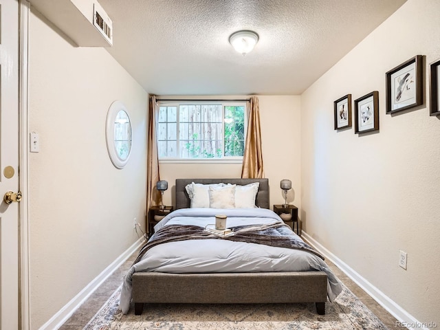 3304 W 3rd Ave, Denver, CO 80219 - bedroom featuring a textured ceiling and carpet floors