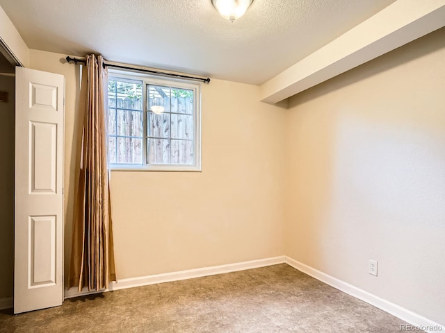 3304 W 3rd Ave, Denver, CO 80219 - carpeted spare room with a textured ceiling and baseboards