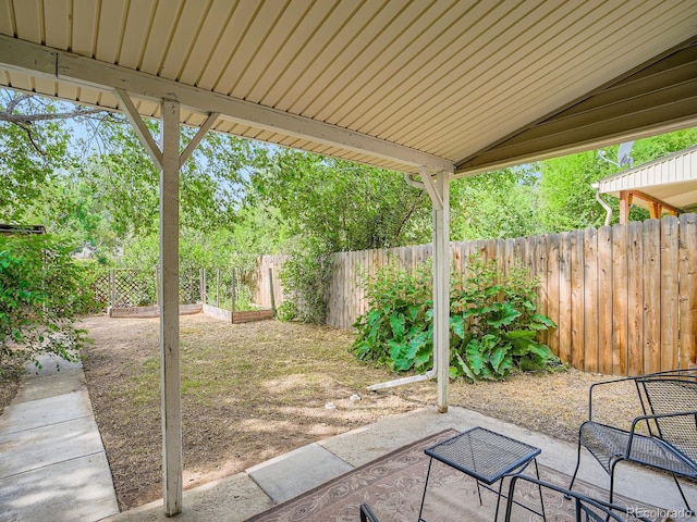 3304 W 3rd Ave, Denver, CO 80219 - fenced backyard featuring a patio and a garden