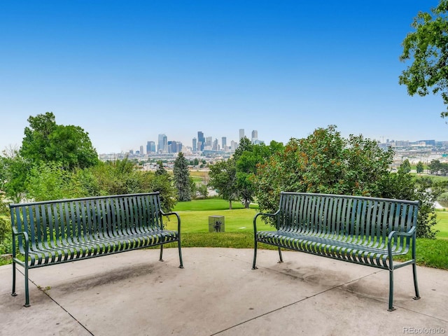 3304 W 3rd Ave, Denver, CO 80219 - view of home's community featuring a view of skyline, a lawn, and a patio
