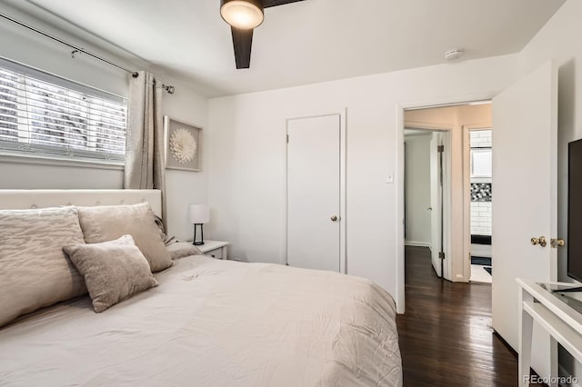 bedroom with dark wood finished floors and a ceiling fan