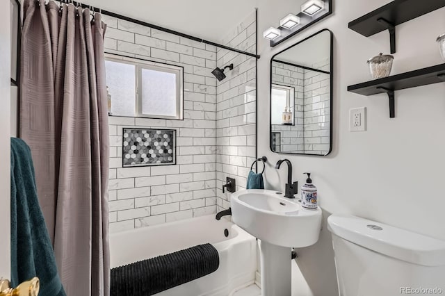 full bathroom with toilet and shower / bath combo