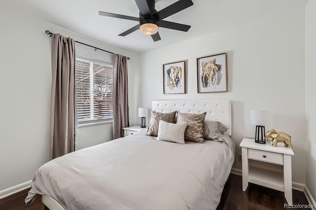 bedroom featuring baseboards, dark wood-style floors, and a ceiling fan