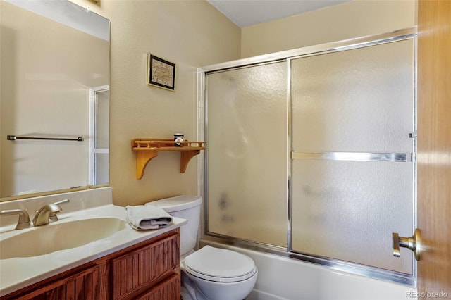 full bathroom with toilet, shower / bath combination with glass door, and vanity