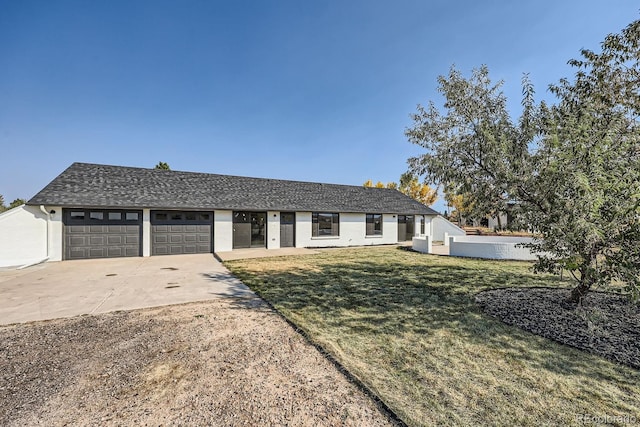 ranch-style house with a front lawn and a garage