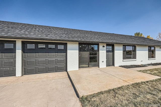 single story home featuring a garage