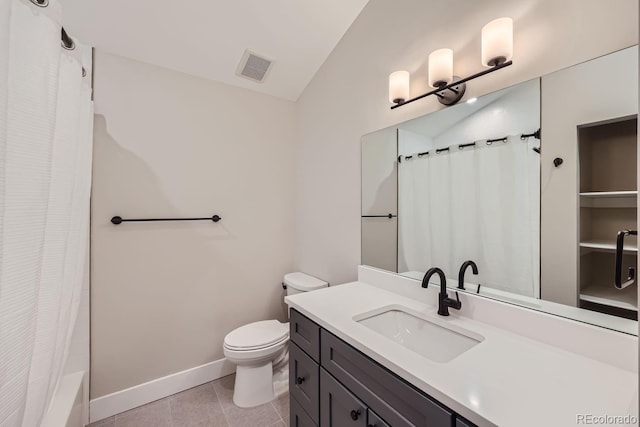 full bathroom with vanity, shower / bath combo with shower curtain, tile patterned floors, vaulted ceiling, and toilet