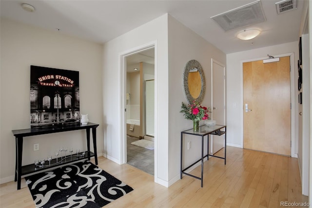 1438 Little Raven St Unit 306, Denver, CO 80202 - hallway featuring wood finished floors and baseboards