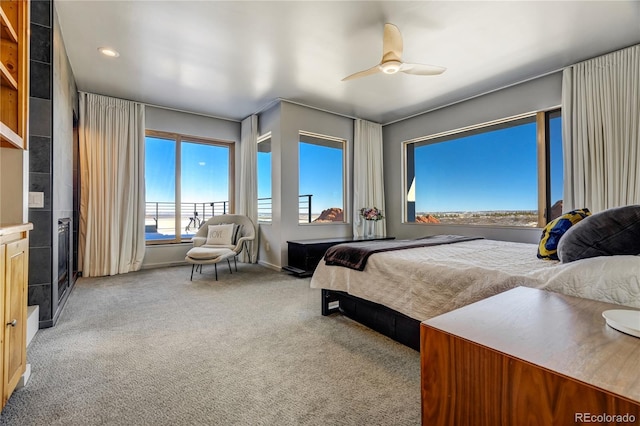 bedroom with light carpet and ceiling fan