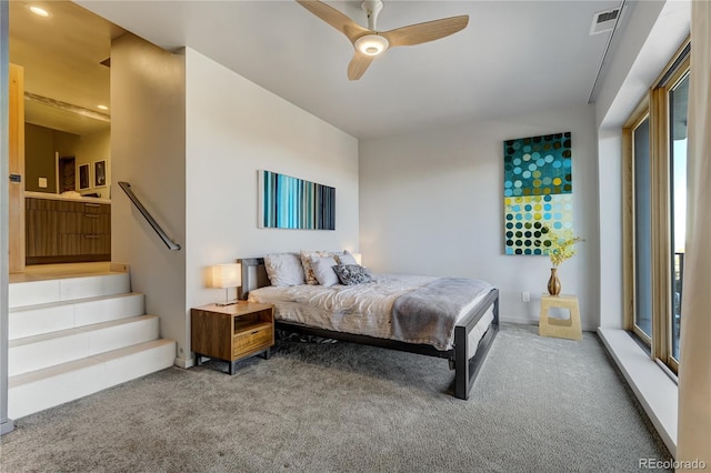 bedroom with ceiling fan and carpet