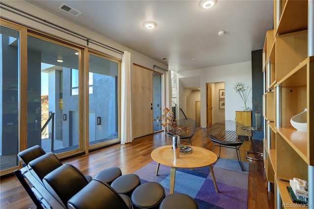 living room with dark hardwood / wood-style flooring