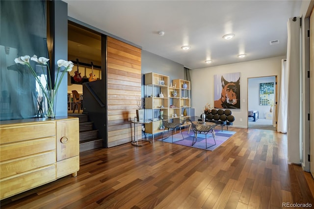 sitting room with dark hardwood / wood-style flooring