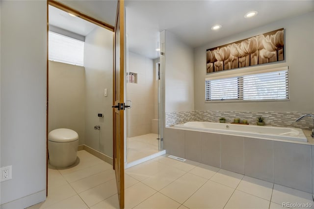 bathroom featuring toilet, separate shower and tub, and tile patterned flooring