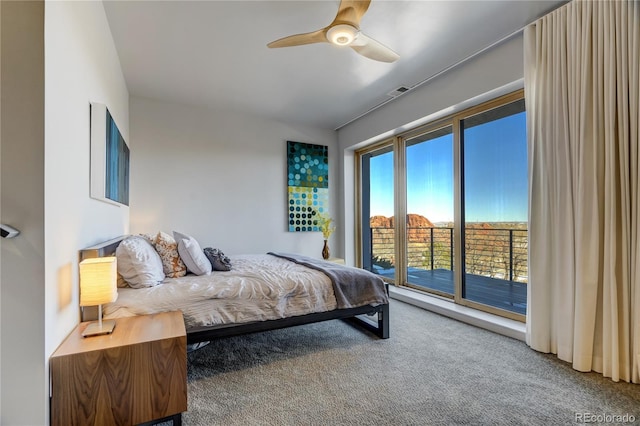 carpeted bedroom with ceiling fan and access to outside