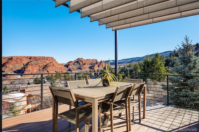 wooden deck featuring a mountain view