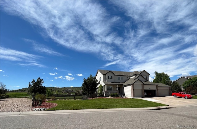 view of front facade featuring a front lawn and a garage